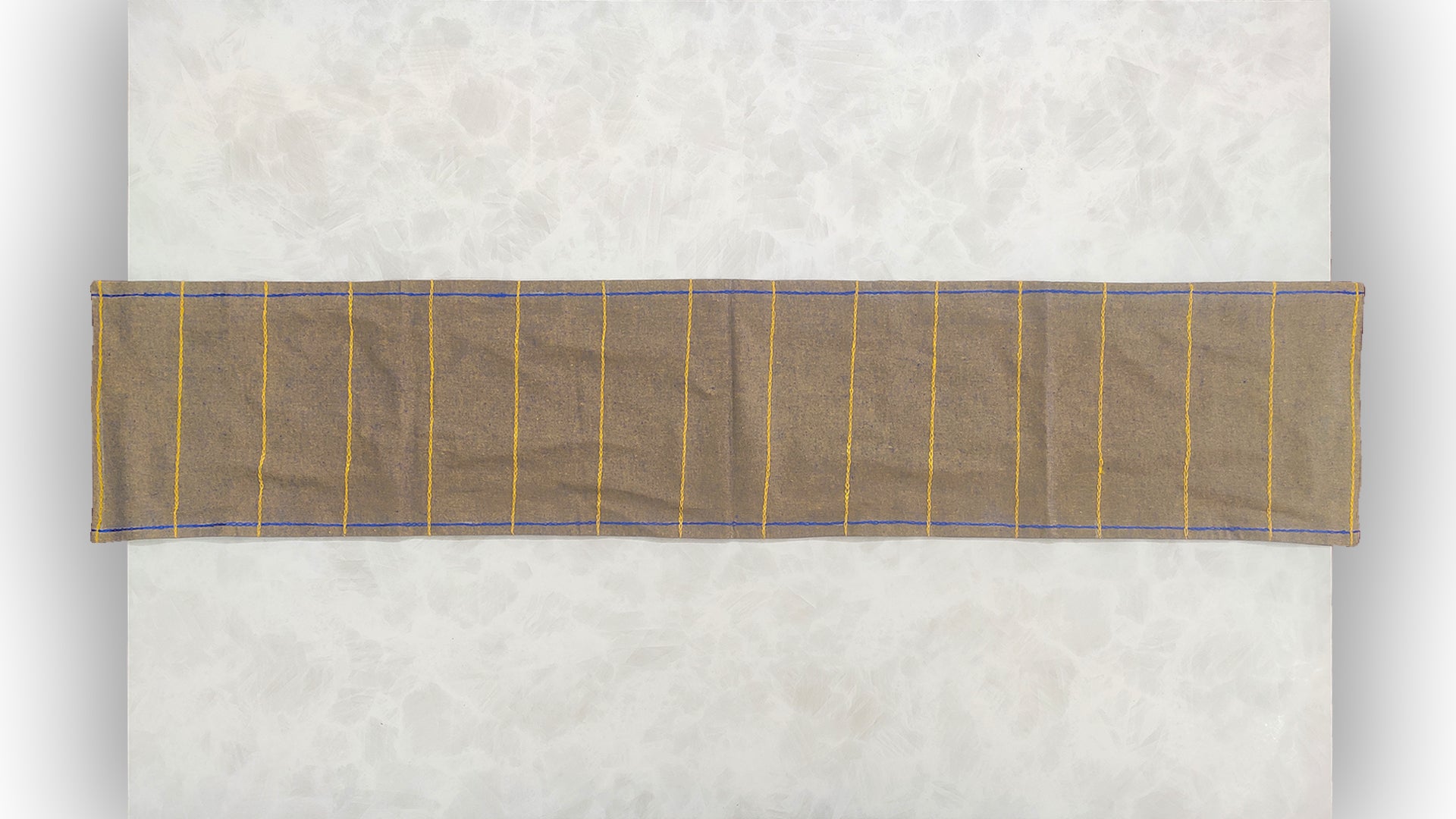 Hand embroidered with purple and yellow golden cotton thread, this handcrafted table runner is paired with set of 6 lap napkins. Designed to be double sided.