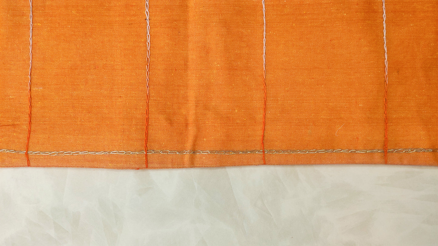 Hand embroidered with off white cotton thread with golden zari, this handcrafted table runner is designed to be double sided.