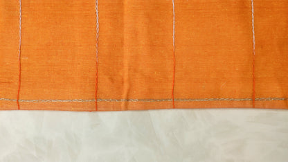Hand embroidered with off white cotton thread with golden zari, this handcrafted table runner is designed to be double sided.