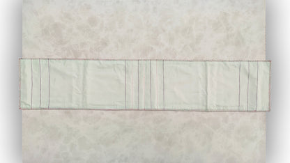 Hand embroidered with pink and purple cotton thread with golden zari, this handcrafted table runner is paired with set of 6 lap napkins. Designed to be double sided.